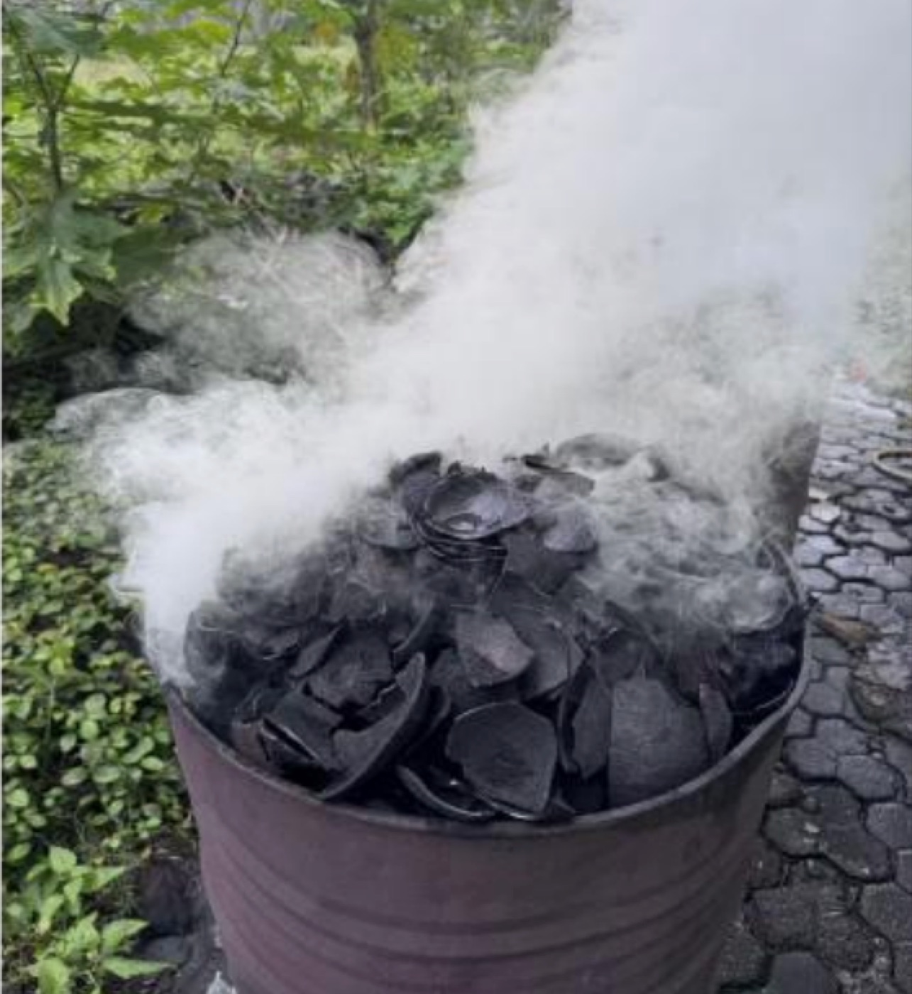 Traditional coconut shell carbonization site in Indonesia